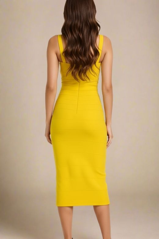 Woman wearing a figure flattering yellow party dress Heidi Bandage Midi Dress - Sun Yellow Bodycon Collection