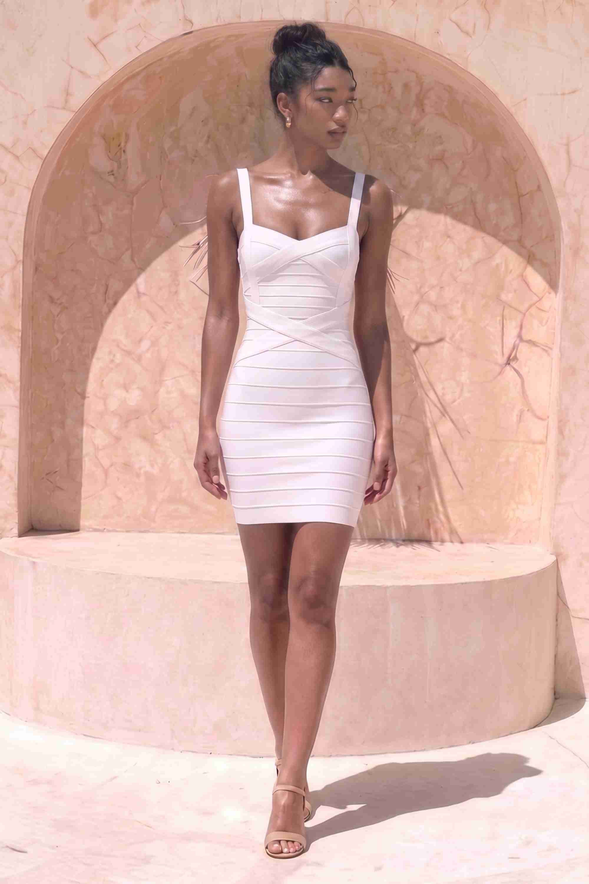 Woman wearing a figure flattering Heidi Bandage Mini Dress - Pearl White Bodycon Collection
