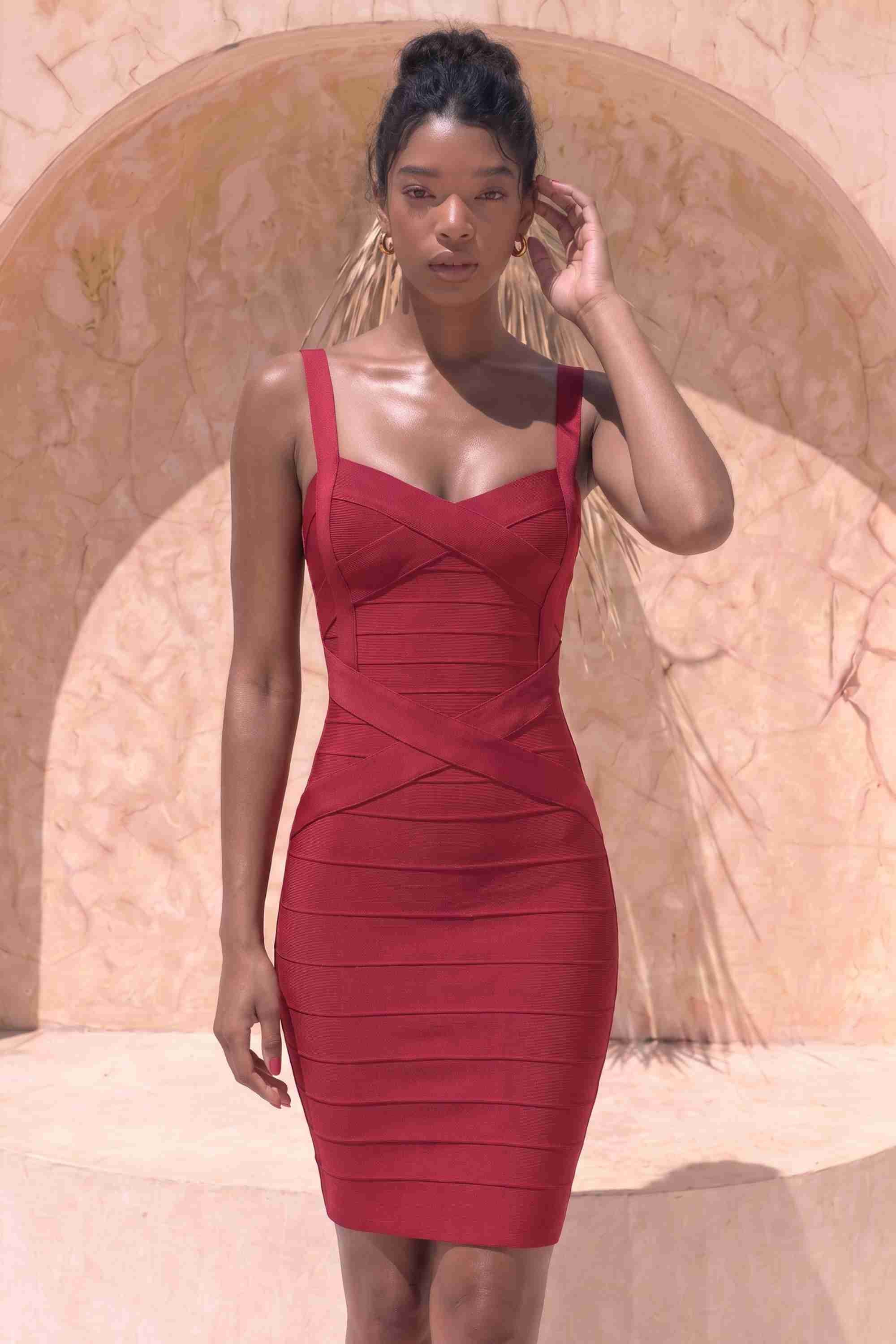 Woman wearing a figure flattering Heidi Bandage Mini Dress - Red Wine Bodycon Collection