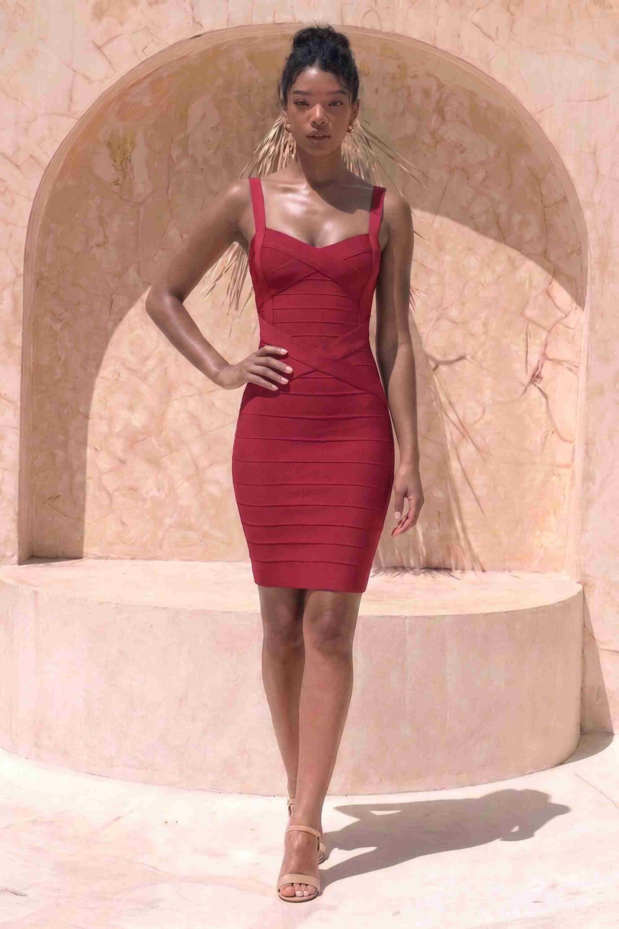 Woman wearing a figure flattering Heidi Bandage Mini Dress - Red Wine Bodycon Collection