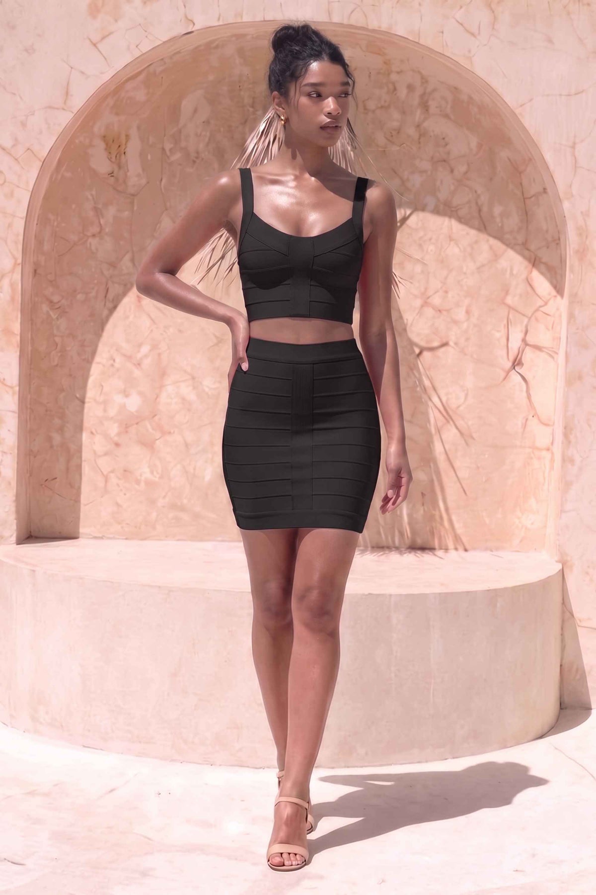 Woman wearing a figure flattering India Bandage Top and Mini Skirt Outfit Set - Classic Black BODYCON COLLECTION