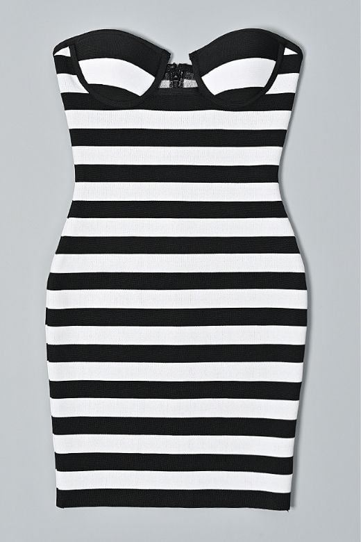 Woman wearing a figure flattering Ingrid Bandage Mini Dress - Classic Black BODYCON COLLECTION