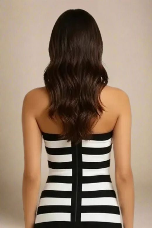 Woman wearing a figure flattering Ingrid Bandage Mini Dress - Classic Black BODYCON COLLECTION