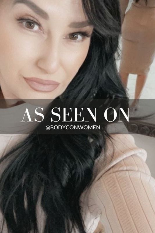 Woman wearing a figure flattering Jane Long Sleeve Bodycon Midi Dress - Lipstick Red Bodycon Collection