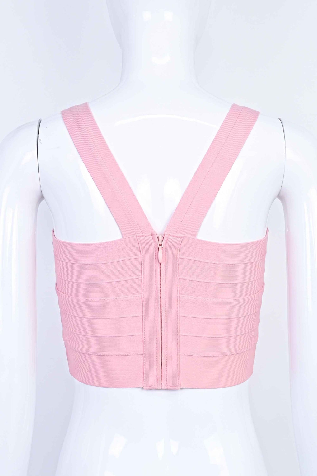 Woman wearing a figure flattering Jay Bandage Crop Top - Dusty Pink BODYCON COLLECTION