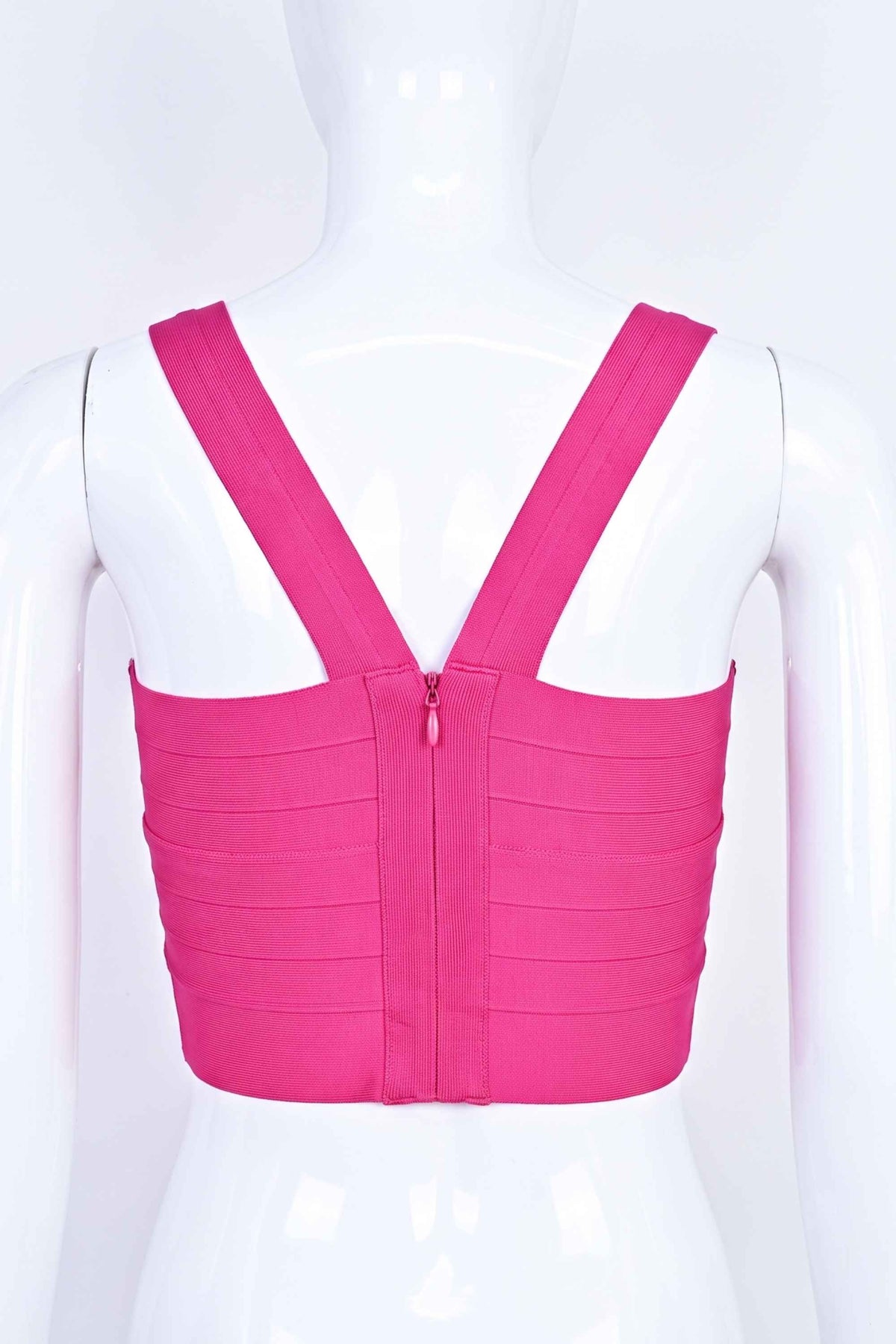 Woman wearing a figure flattering Jay Bandage Crop Top - Hot Pink BODYCON COLLECTION