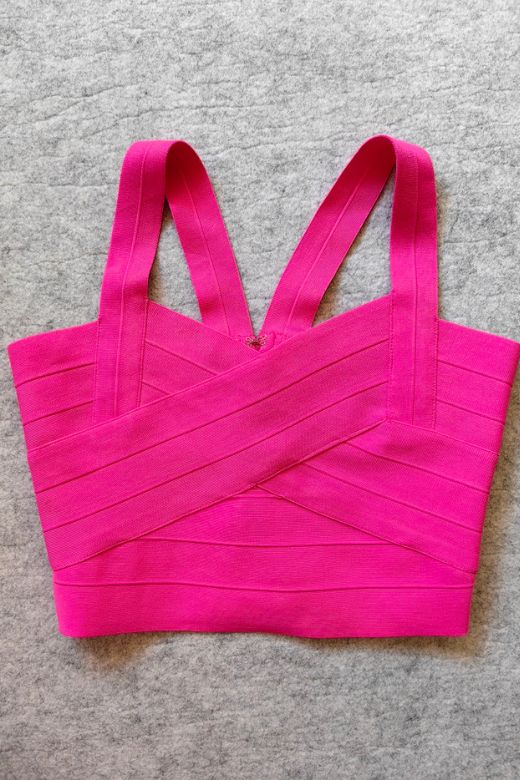 Woman wearing a figure flattering Jay Bandage Crop Top - Hot Pink BODYCON COLLECTION