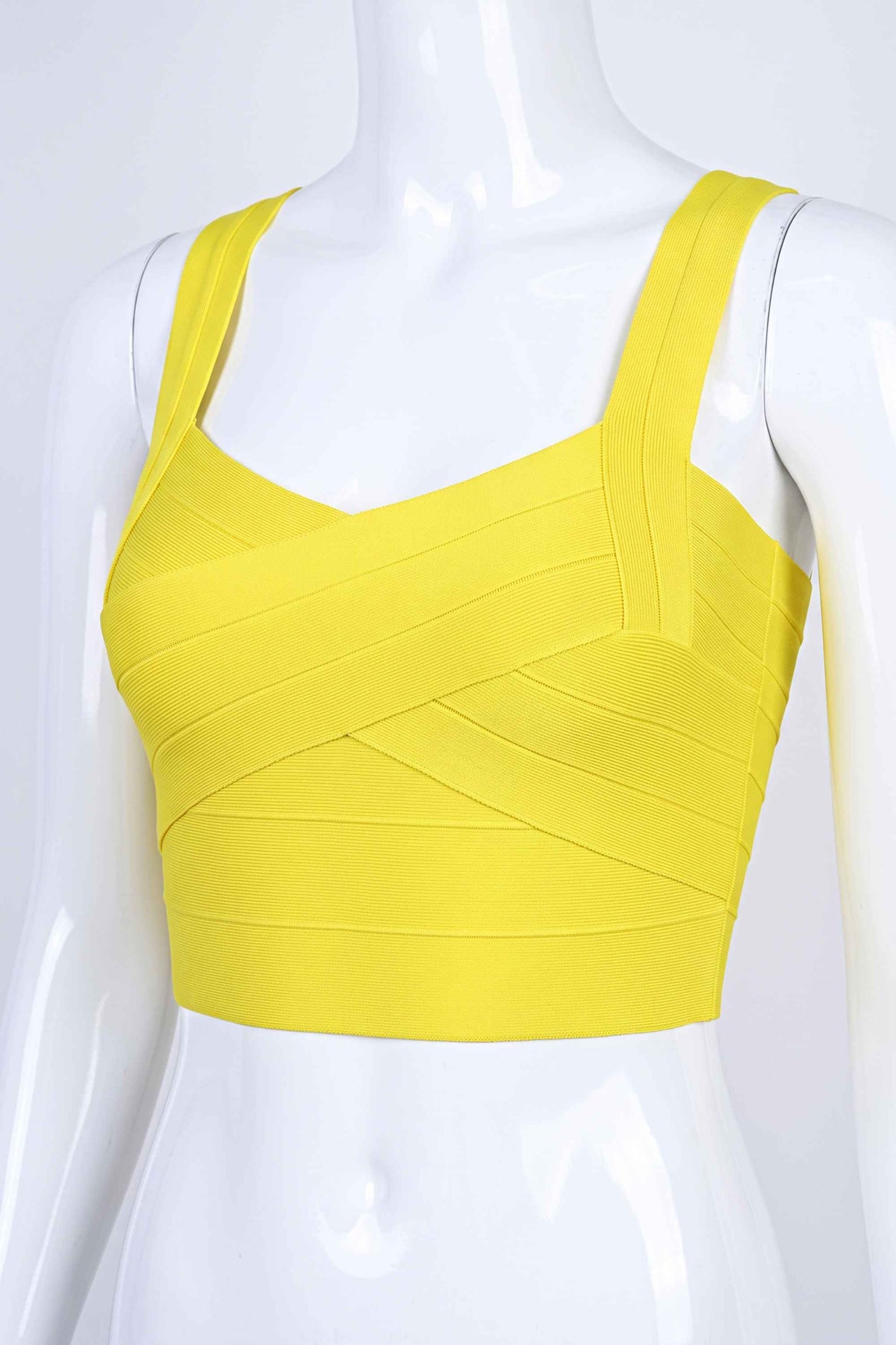 Woman wearing a figure flattering Jay Bandage Crop Top - Sun Yellow BODYCON COLLECTION
