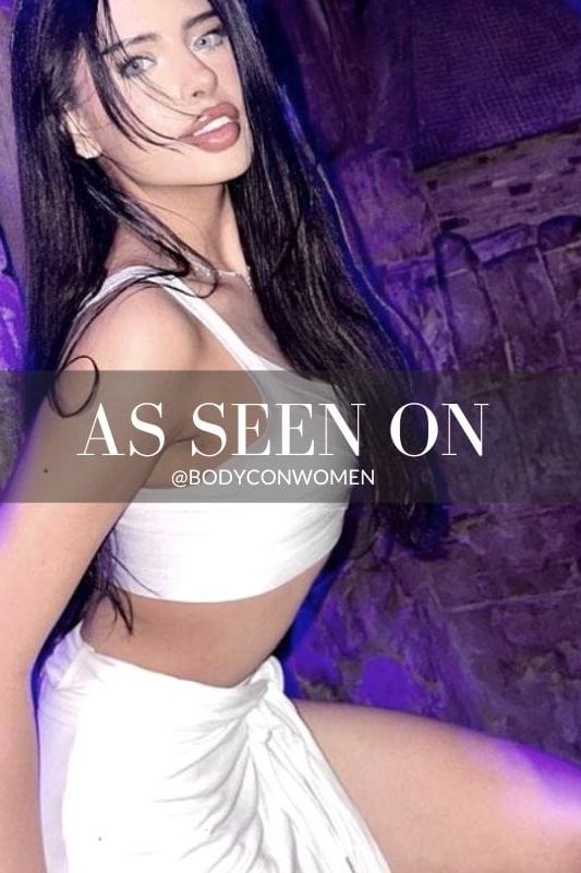 Woman wearing a figure flattering Jay Bandage Top - Pearl White BODYCON COLLECTION