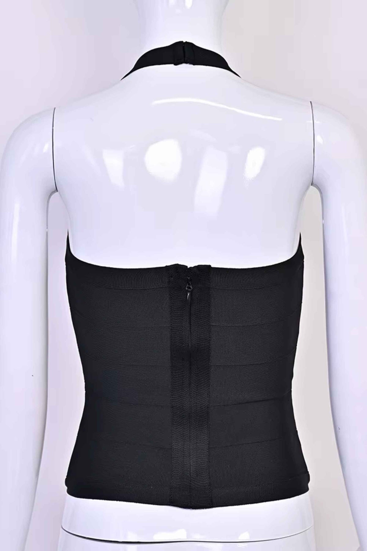 Woman wearing a figure flattering Jenna Bandage Top - Classic Black BODYCON COLLECTION Pty Ltd