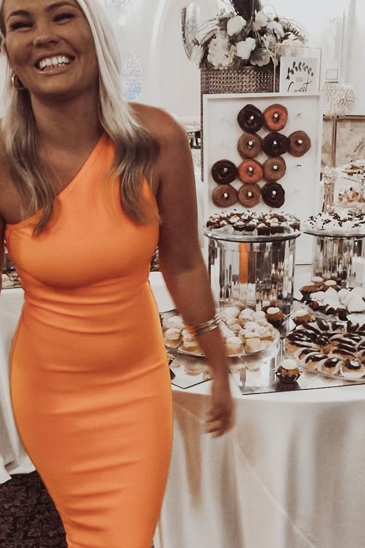 Woman wearing a figure flattering Joi Bodycon Midi Dress - Peach Bodycon Collection