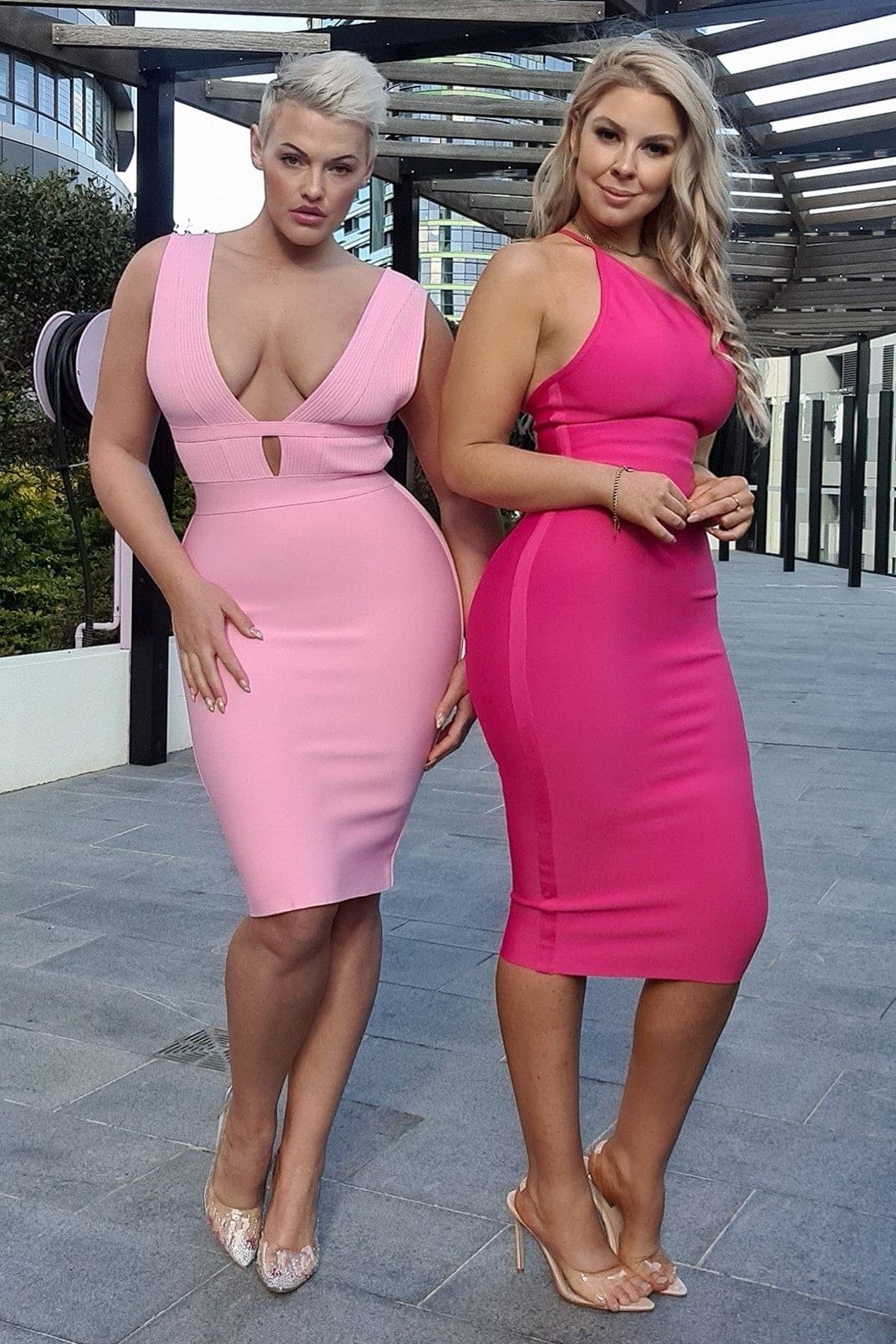 Woman wearing a figure flattering Joi Bodycon Midi Dress - Peach Bodycon Collection