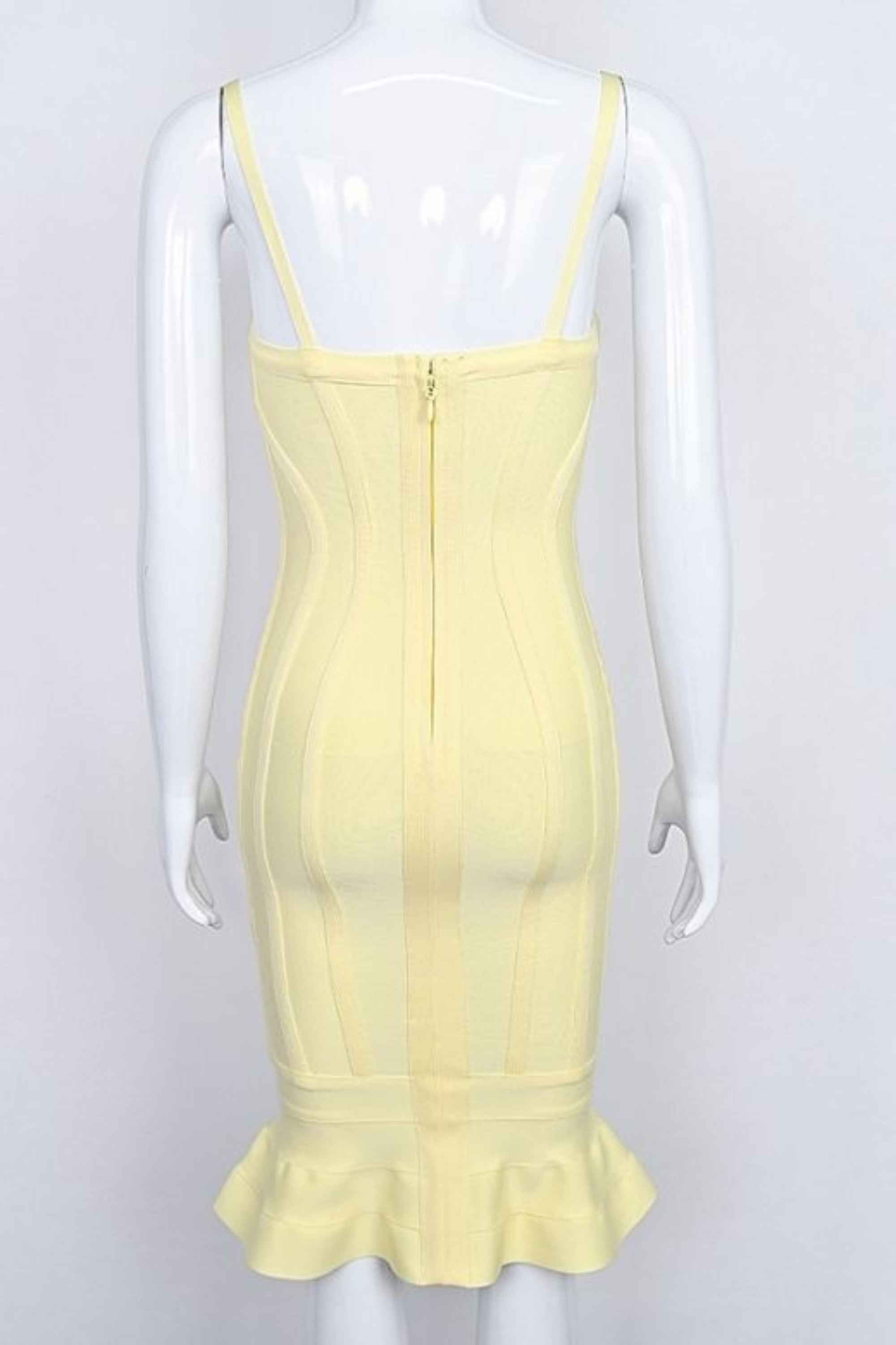 Woman wearing a figure flattering Joy Bandage Midi Dress - Sun Yellow Bodycon Collection