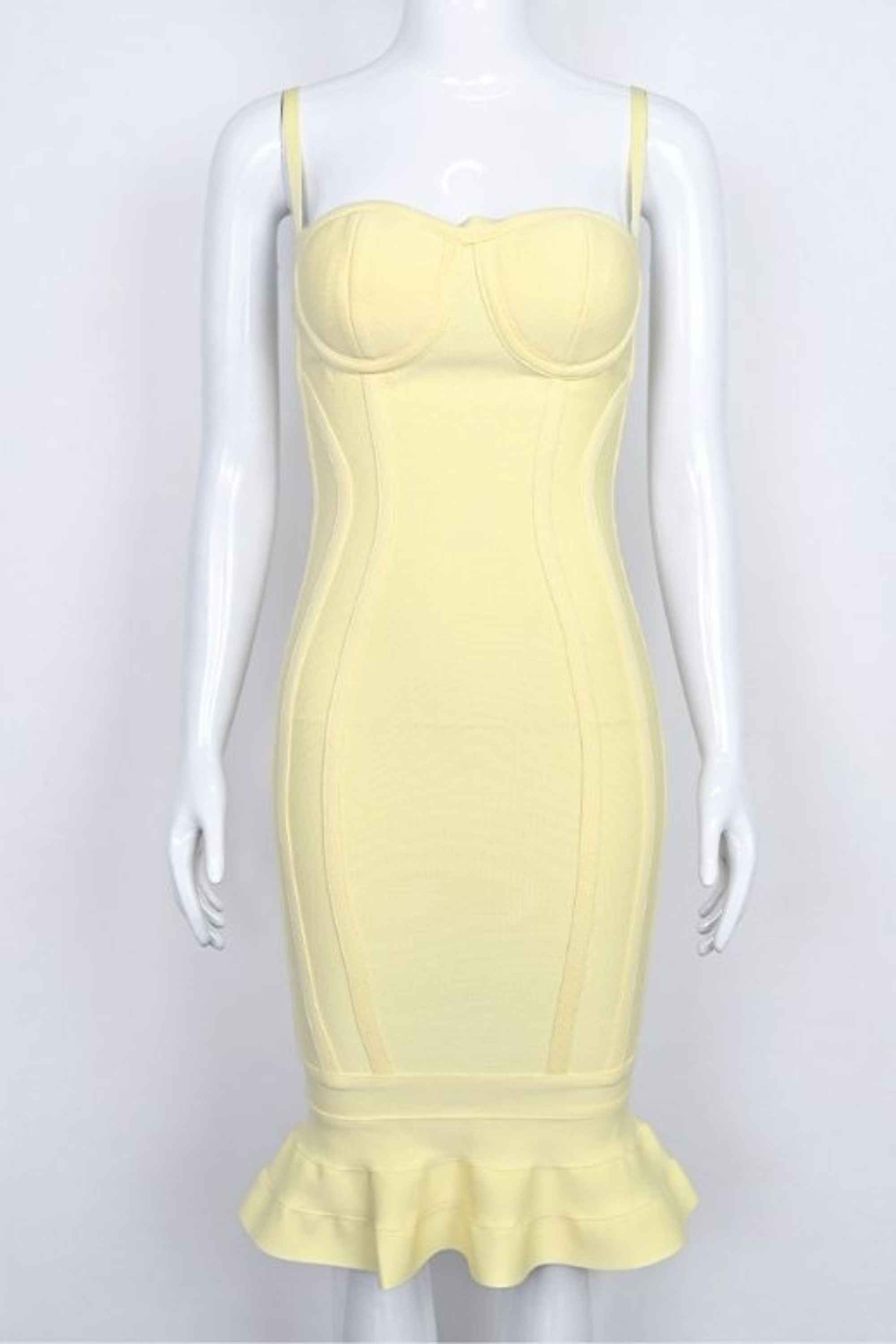 Woman wearing a figure flattering Joy Bandage Midi Dress - Sun Yellow Bodycon Collection