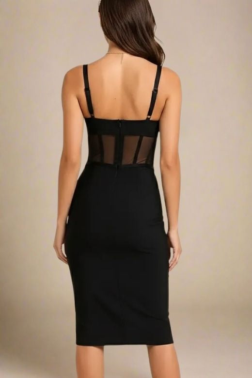 Woman wearing a figure flattering Juliette Bodycon Dress - Classic Black Bodycon Collection