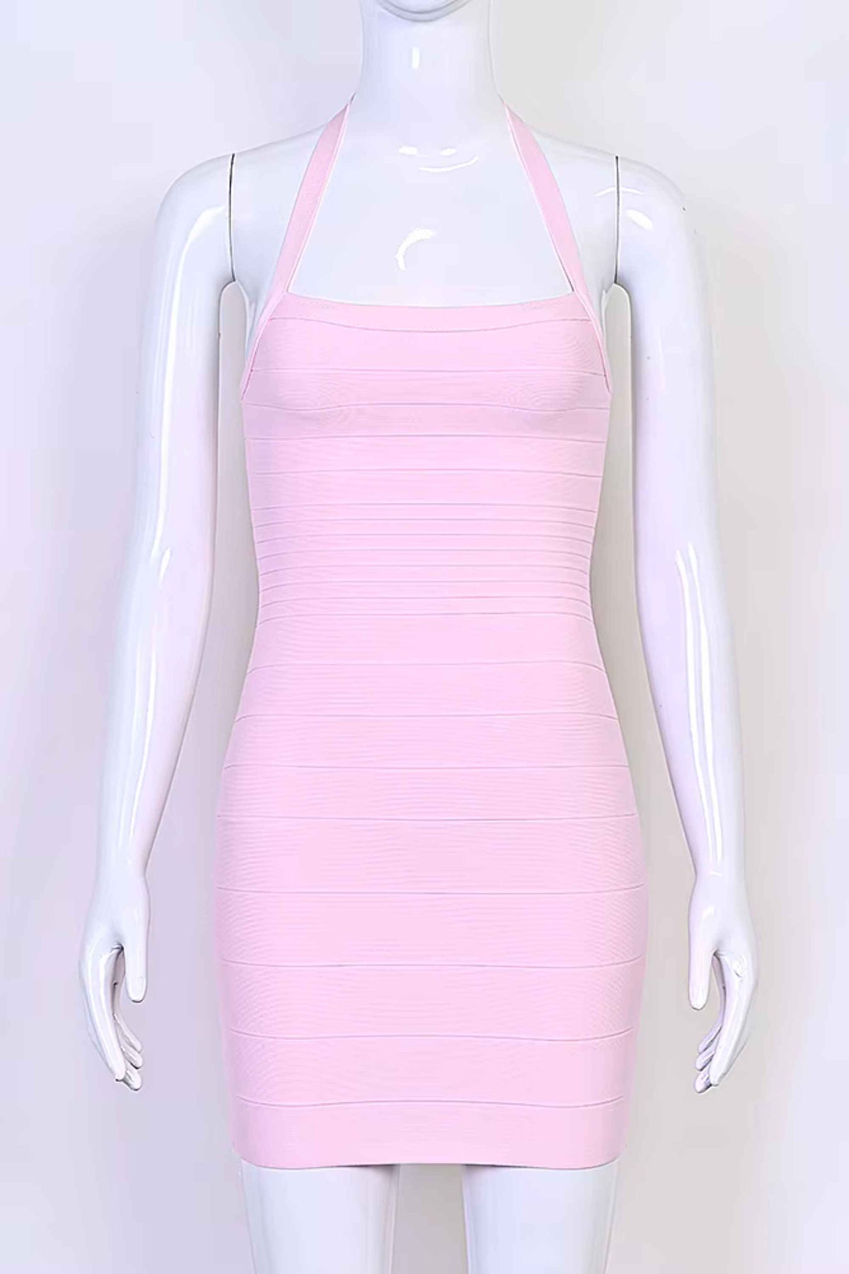 Woman wearing a figure flattering Kia Bandage Mini Dress - Dusty Pink BODYCON COLLECTION Pty Ltd