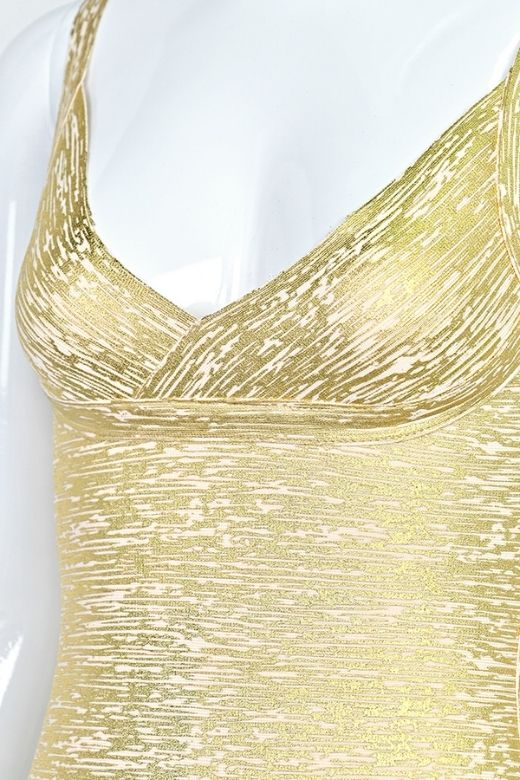 Woman wearing a figure flattering Kit Bandage Dress - Gold Bodycon Collection