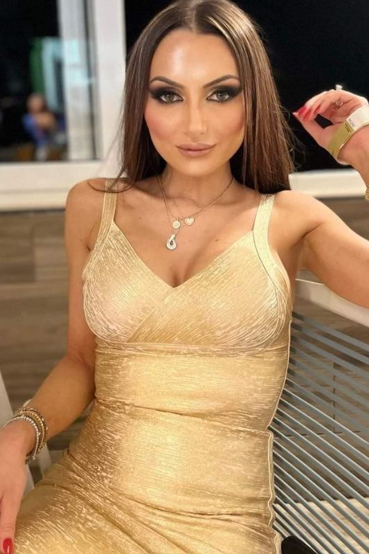Woman wearing a figure flattering  Kit Bandage Dress - Gold Bodycon Collection