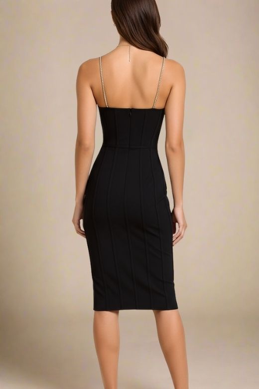 Woman wearing a figure flattering Leah Bodycon Dress - Classic Black Bodycon Collection