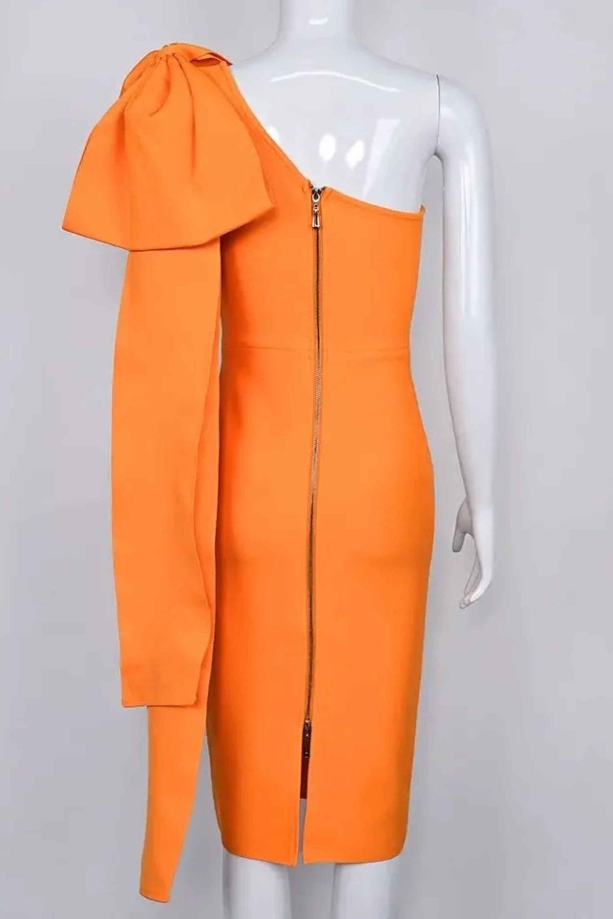 Woman wearing a figure flattering Lela Long Sleeve Bandage Midi Dress - Apricot Orange BODYCON COLLECTION