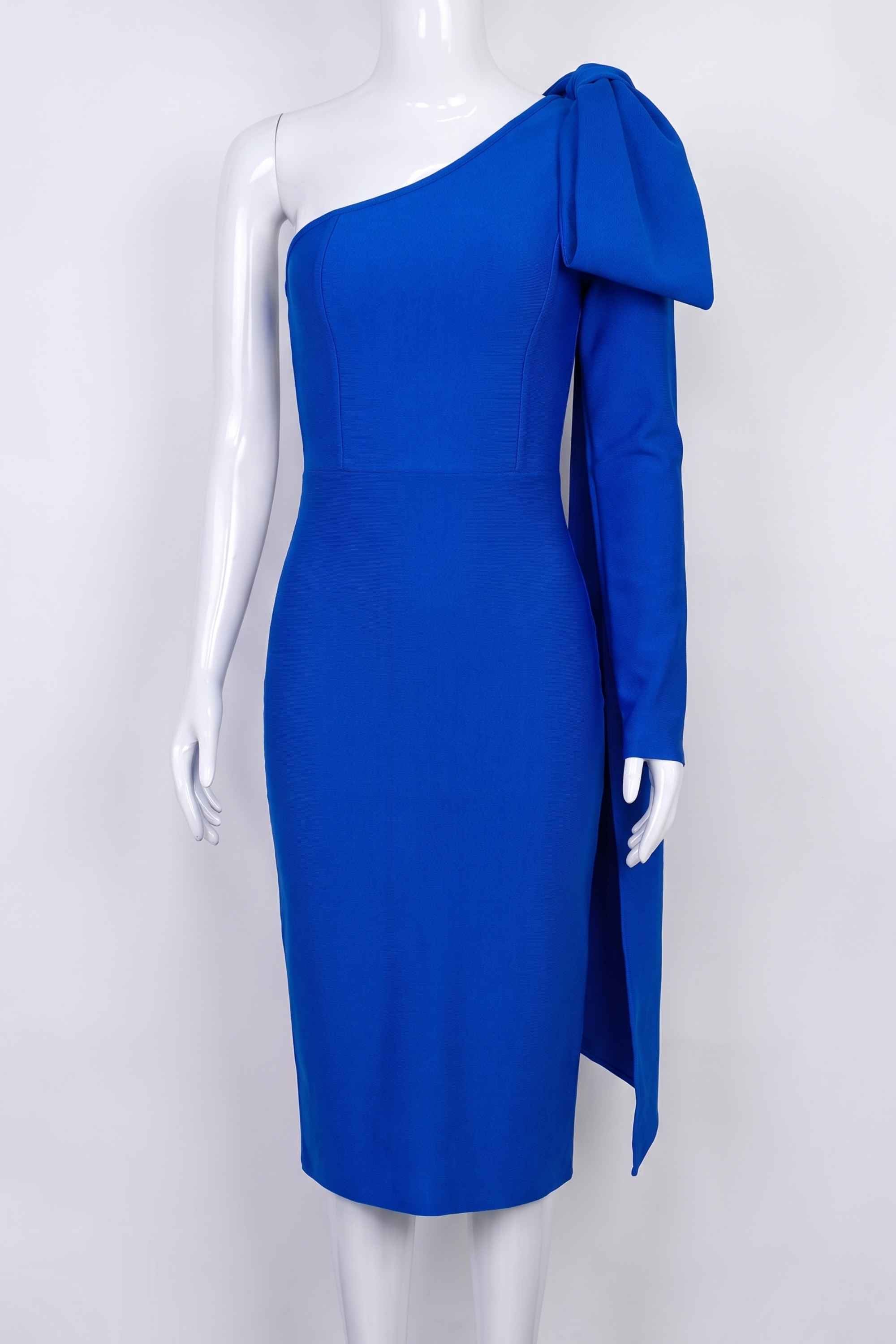 Woman wearing a figure flattering Lela Long Sleeve Bandage Midi Dress - Royal Blue BODYCON COLLECTION