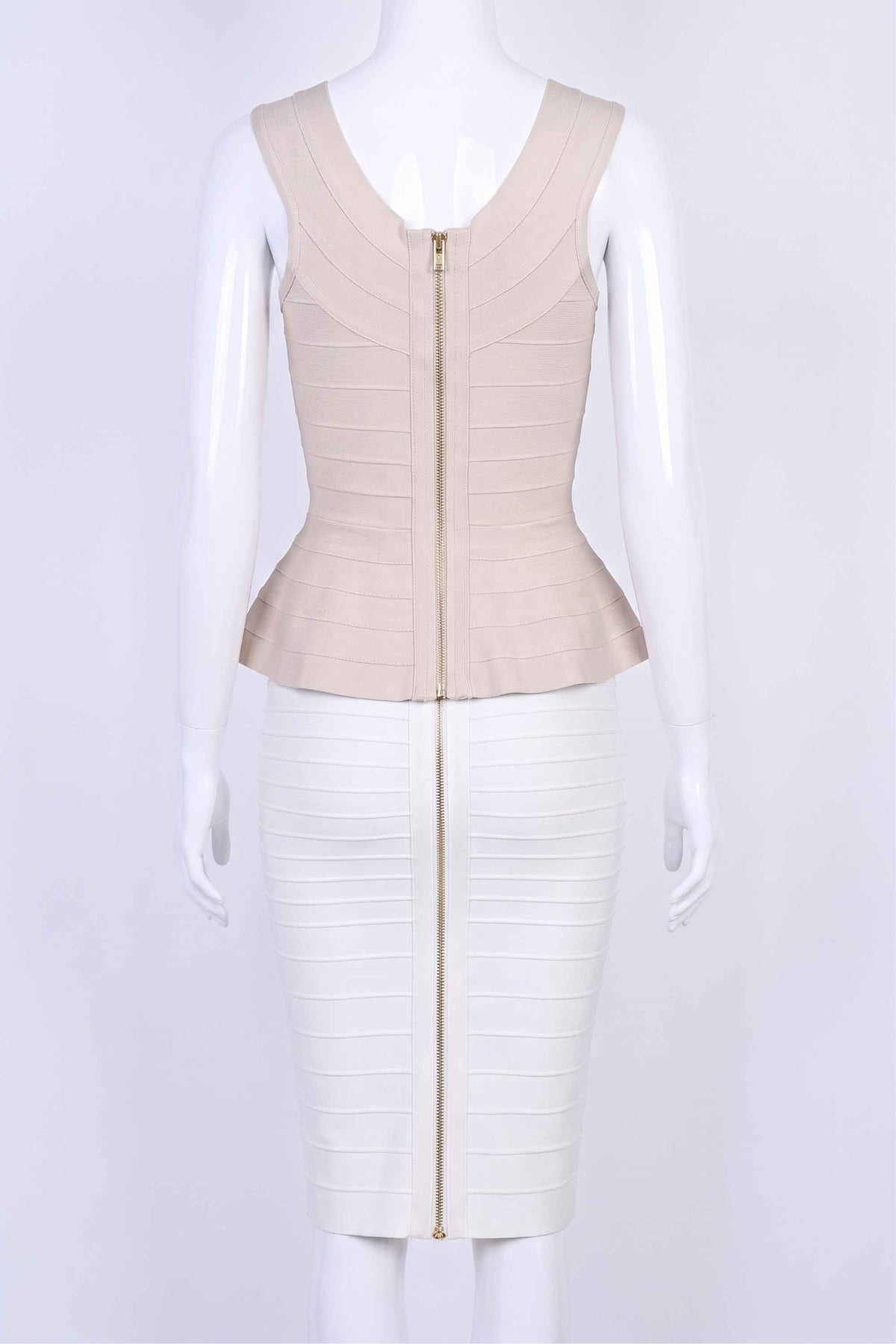 Woman wearing a figure flattering Leni Bandage Peplum Top - Beige BODYCON COLLECTION