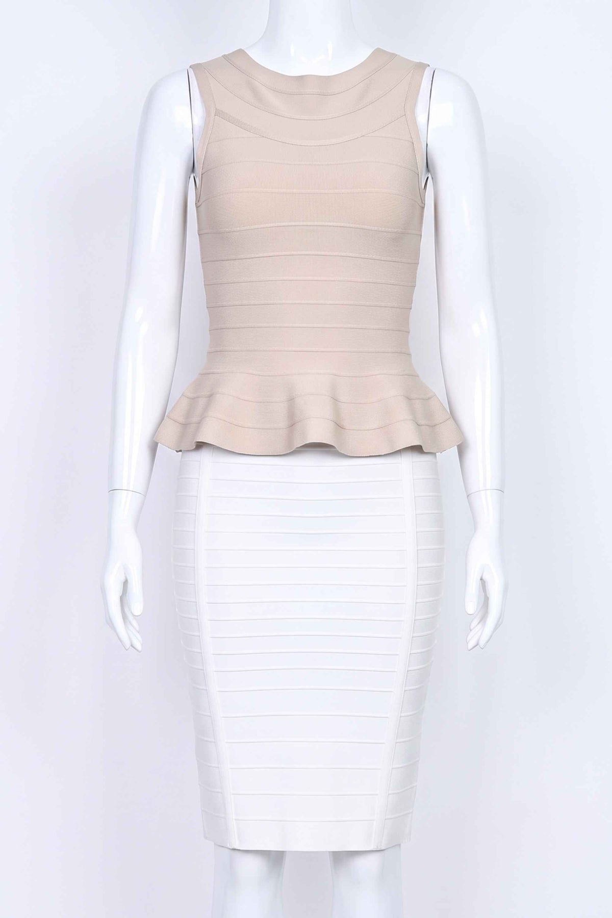Woman wearing a figure flattering Leni Bandage Peplum Top - Beige BODYCON COLLECTION