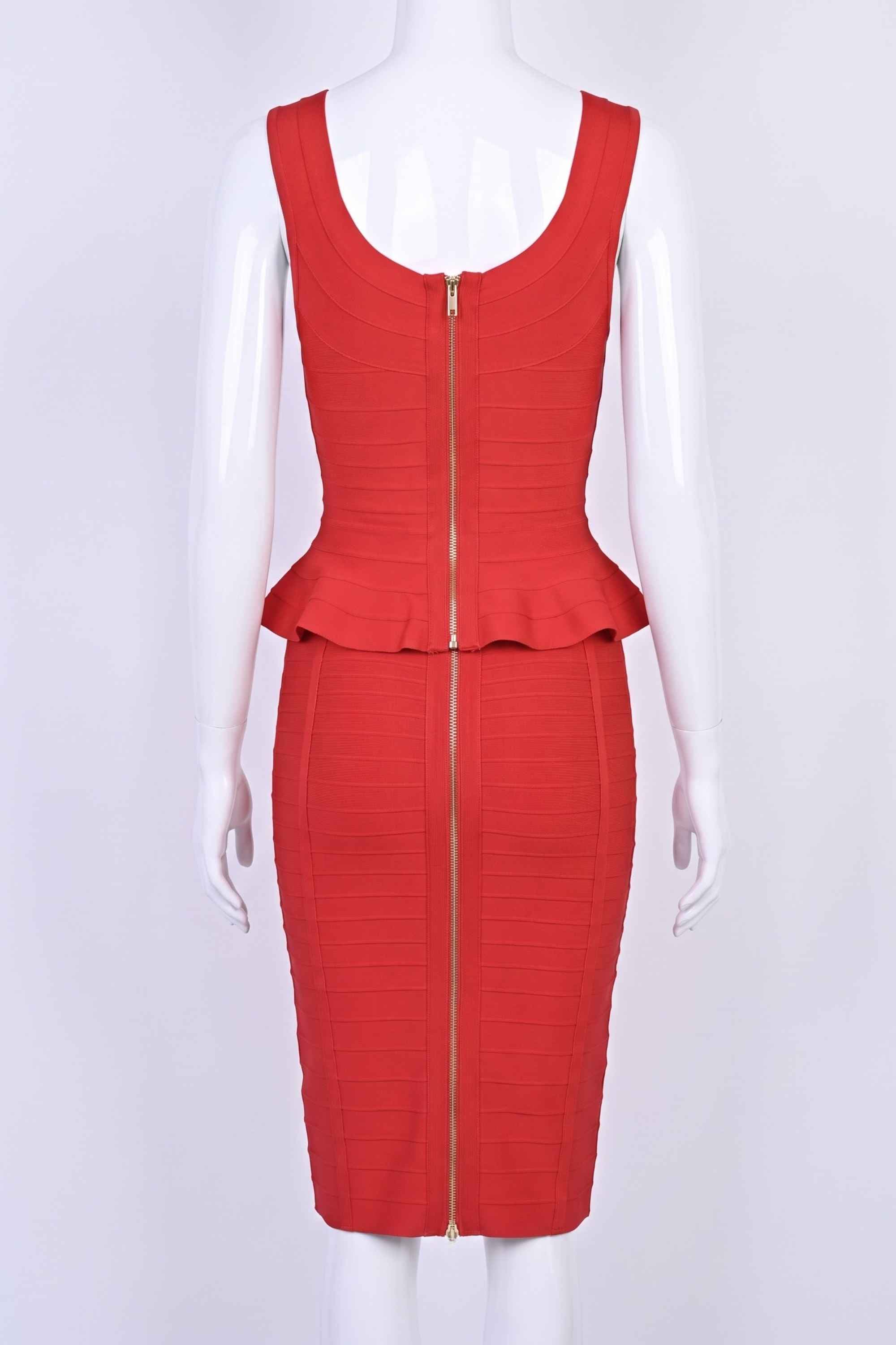 Woman wearing a figure flattering Leni Bandage Peplum Top - Lipstick Red BODYCON COLLECTION