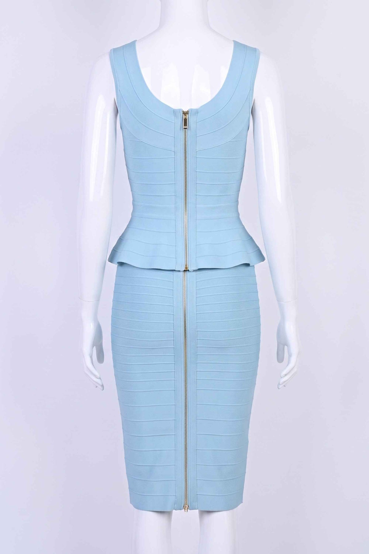 Woman wearing a figure flattering Leni Bandage Top - Sky Blue BODYCON COLLECTION