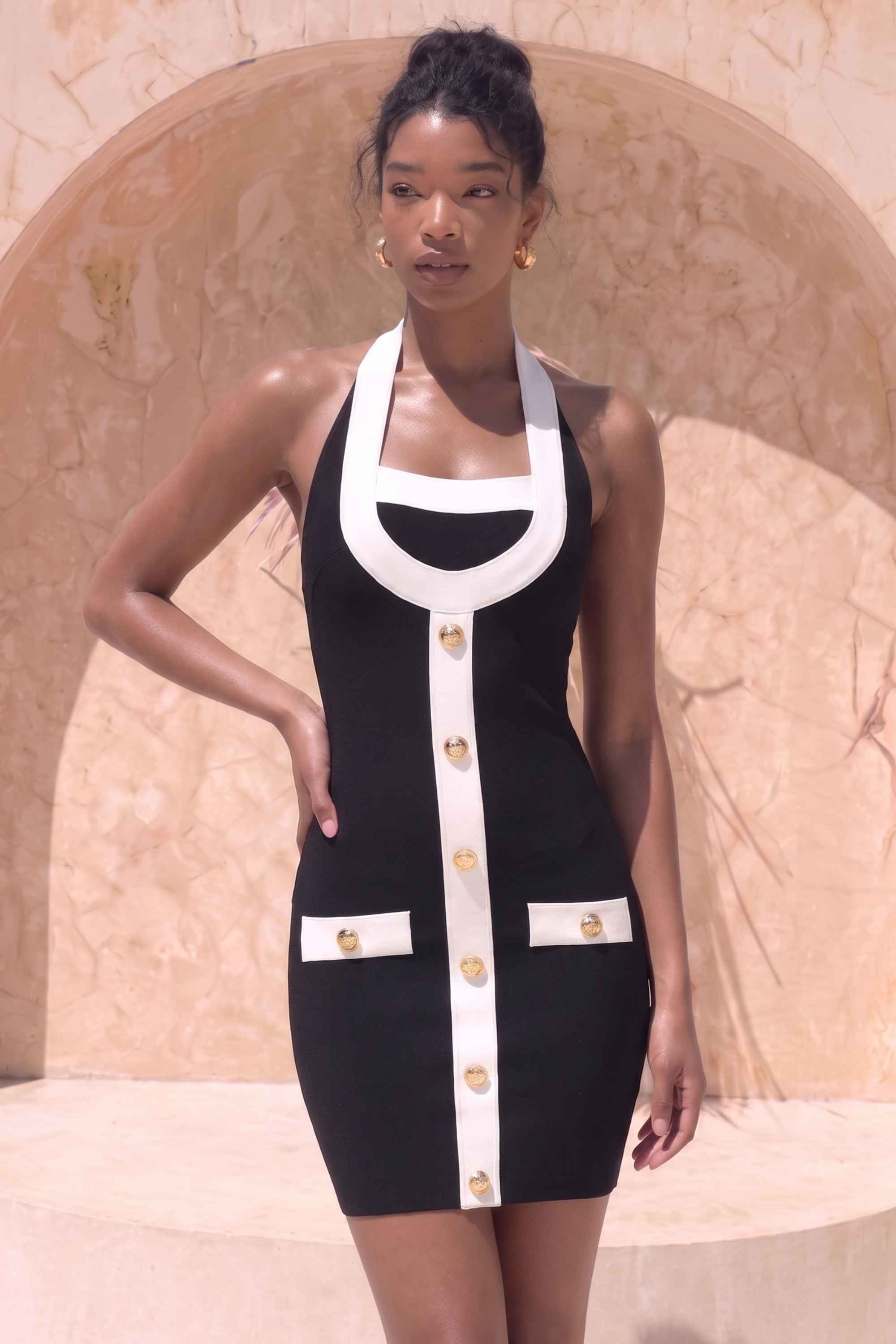 Woman wearing a figure flattering Leone Bandage Mini Dress - Classic Black BODYCON COLLECTION Pty Ltd