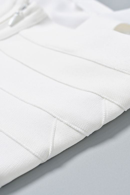 Woman wearing a figure flattering Madelyn Bandage Mini Dress - White Pearl BODYCON COLLECTION Pty Ltd