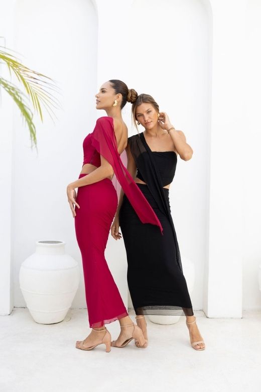 Woman wearing a figure flattering Margot Wrap Top and Maxi Skirt Outfit Set - Red Wine BODYCON COLLECTION