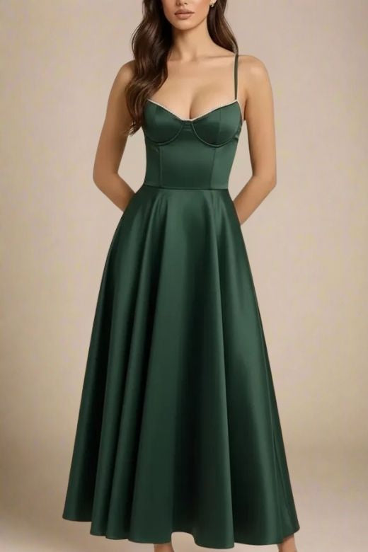 Woman wearing a figure flattering Mavis Bodycon Midi Dress - Emerald Green BODYCON COLLECTION
