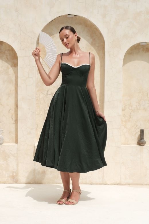 Woman wearing a figure flattering Mavis Midi Dress - Classic Black BODYCON COLLECTION