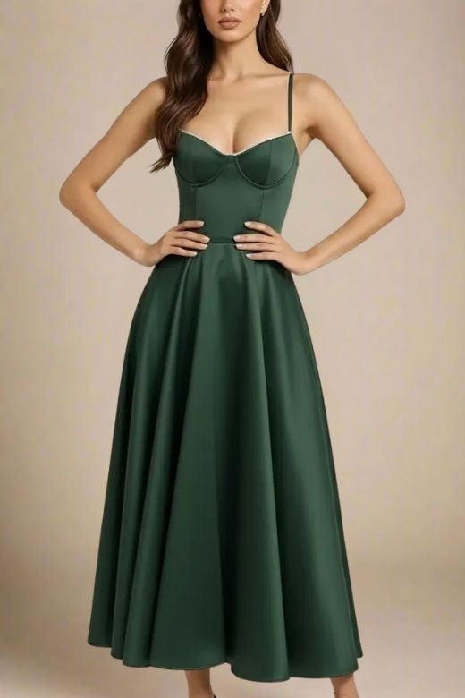 Woman wearing a figure flattering Mavis Midi Dress - Emerald Green BODYCON COLLECTION