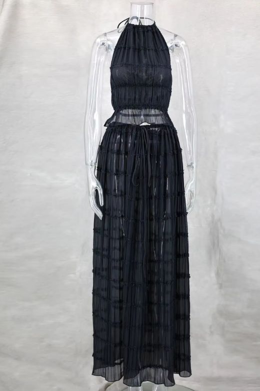 Woman wearing a figure flattering Meryl Wrap Top and Maxi Skirt Set - Classic Black BODYCON COLLECTION
