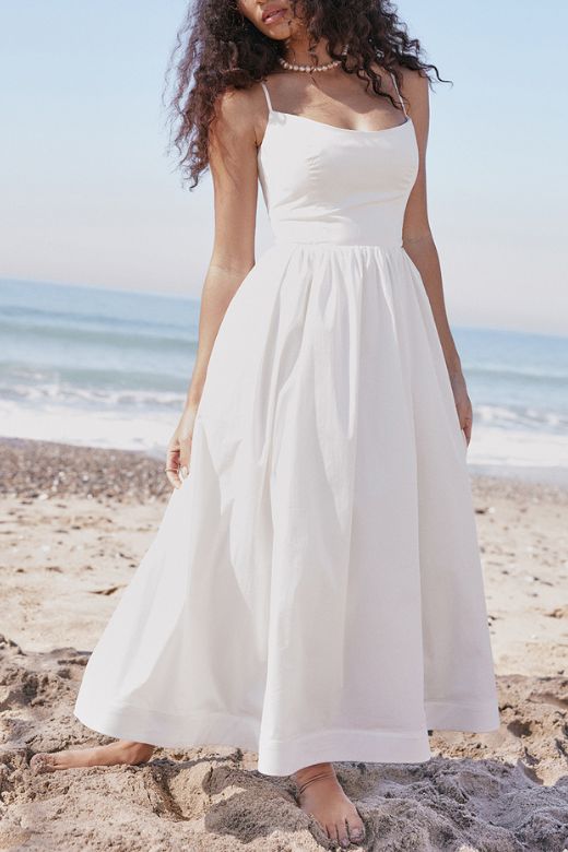 Woman wearing a figure flattering Paloma Bodycon Midi Dress - Pearl White BODYCON COLLECTION