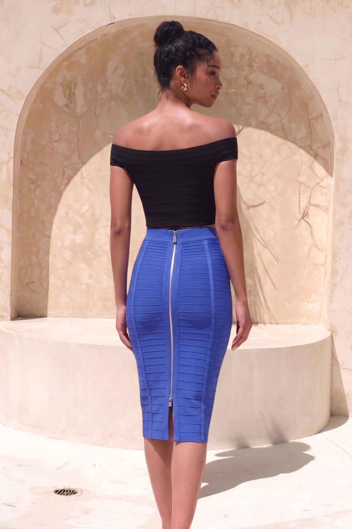 Woman wearing a figure flattering Pencil High Waist Bandage Knee Length Knitted Skirt - Navy Blue BODYCON COLLECTION