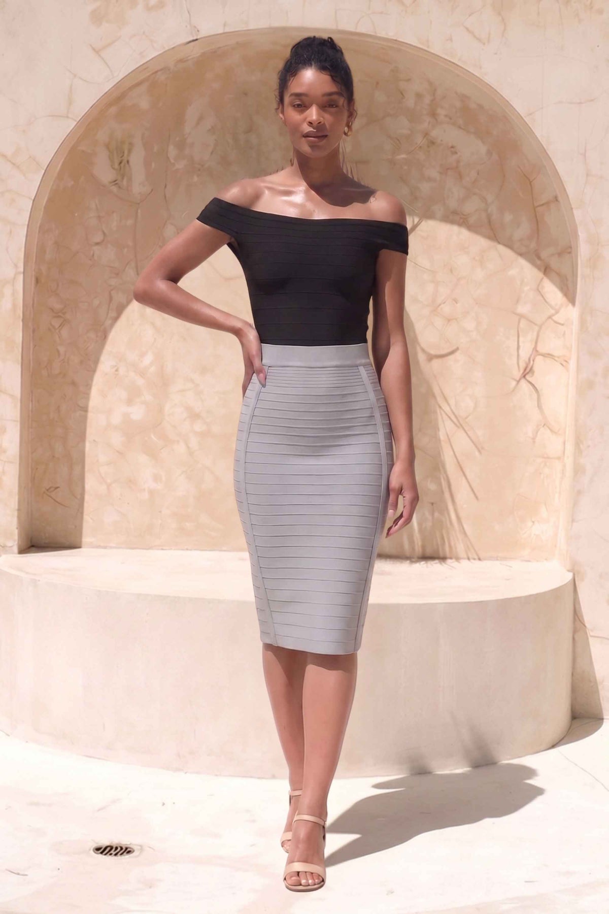 Woman wearing a figure flattering Pencil High Waist Bandage Knee Length Knitted Skirt - Steel Grey BODYCON COLLECTION