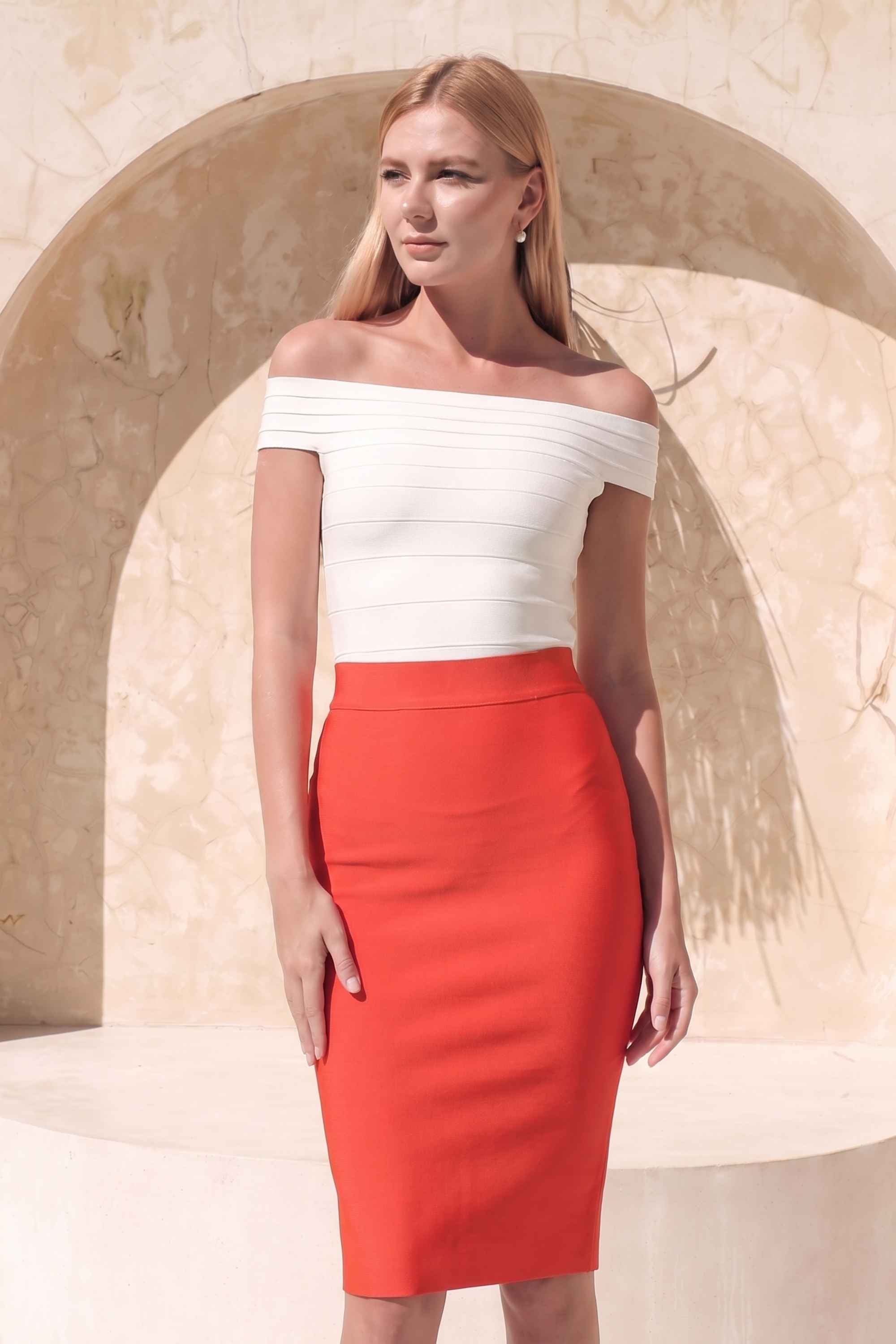 Woman wearing a figure flattering Pencil High Waist Bandage Knee Length Skirt - Lipstick Red BODYCON COLLECTION