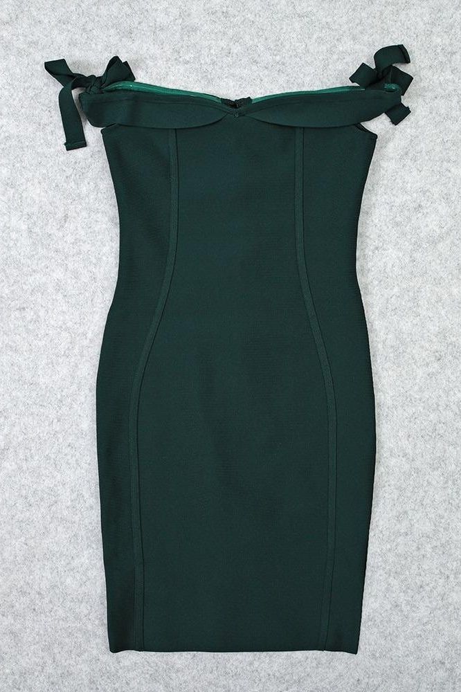 Woman wearing a figure flattering Penelope Bandage Miini Dress - Emerald Green BODYCON COLLECTION