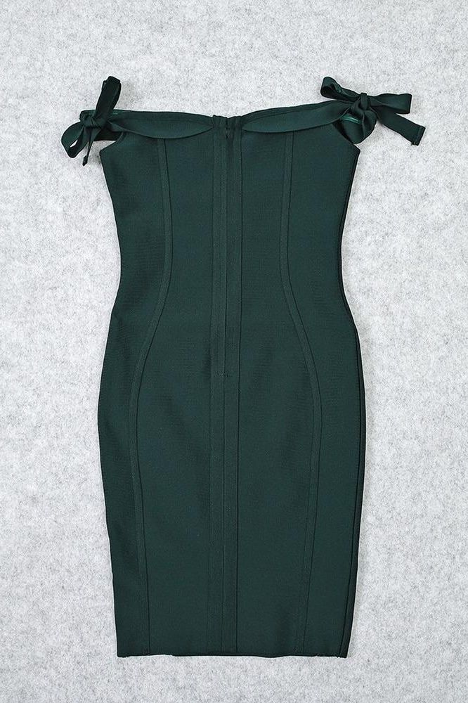 Woman wearing a figure flattering Penelope Bandage Miini Dress - Emerald Green BODYCON COLLECTION