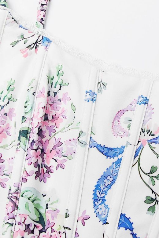 Woman wearing a figure flattering Penny Corset Top - White Floral BODYCON COLLECTION Pty Ltd