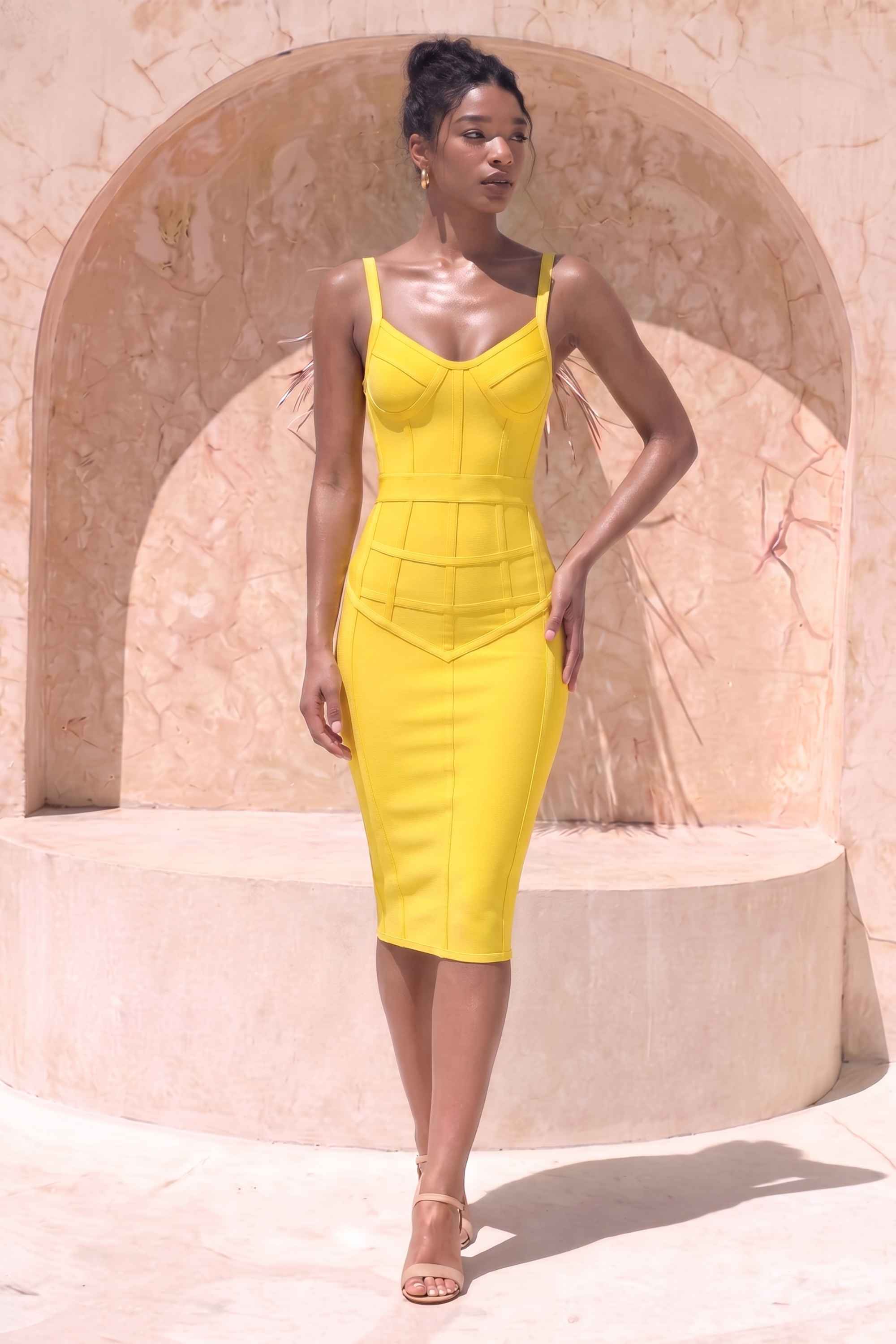 Woman wearing a figure flattering Pip Bandage Corset Dress - Sun Yellow Bodycon Collection