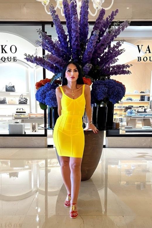 Woman wearing a figure flattering Pip Bandage Mini Dress - Sun Yellow BODYCON COLLECTION