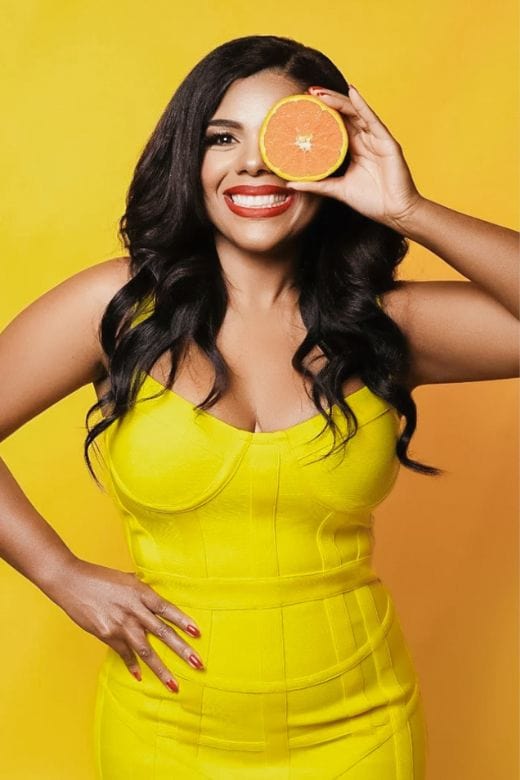 Woman wearing a figure flattering Pip Bandage Mini Dress - Sun Yellow BODYCON COLLECTION