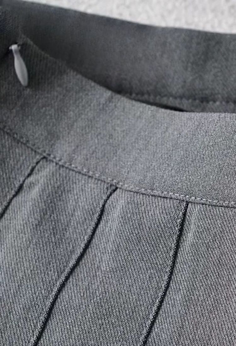 Woman wearing a figure flattering Pleated Mini Skirt - Grey BODYCON COLLECTION Pty Ltd
