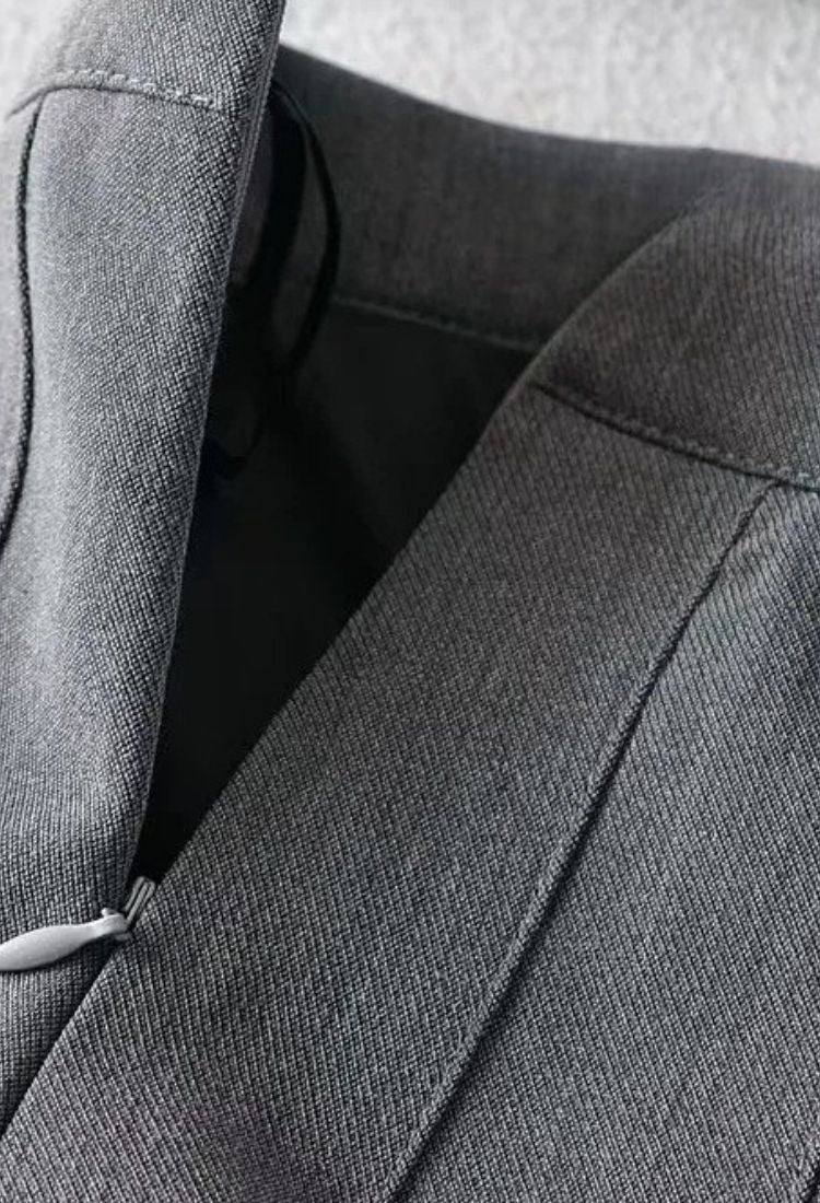 Woman wearing a figure flattering Pleated Mini Skirt - Grey BODYCON COLLECTION Pty Ltd