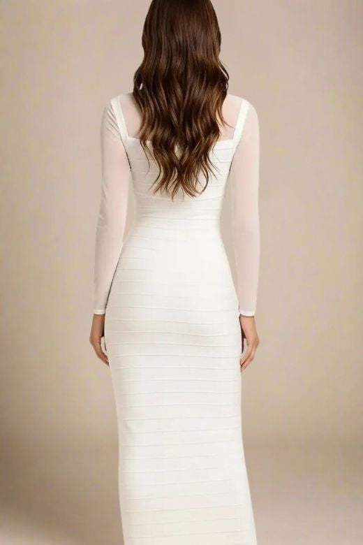 Woman wearing a figure flattering Robin Long Sleeve Bandage Maxi Dress - White Pearl BODYCON COLLECTION Pty Ltd