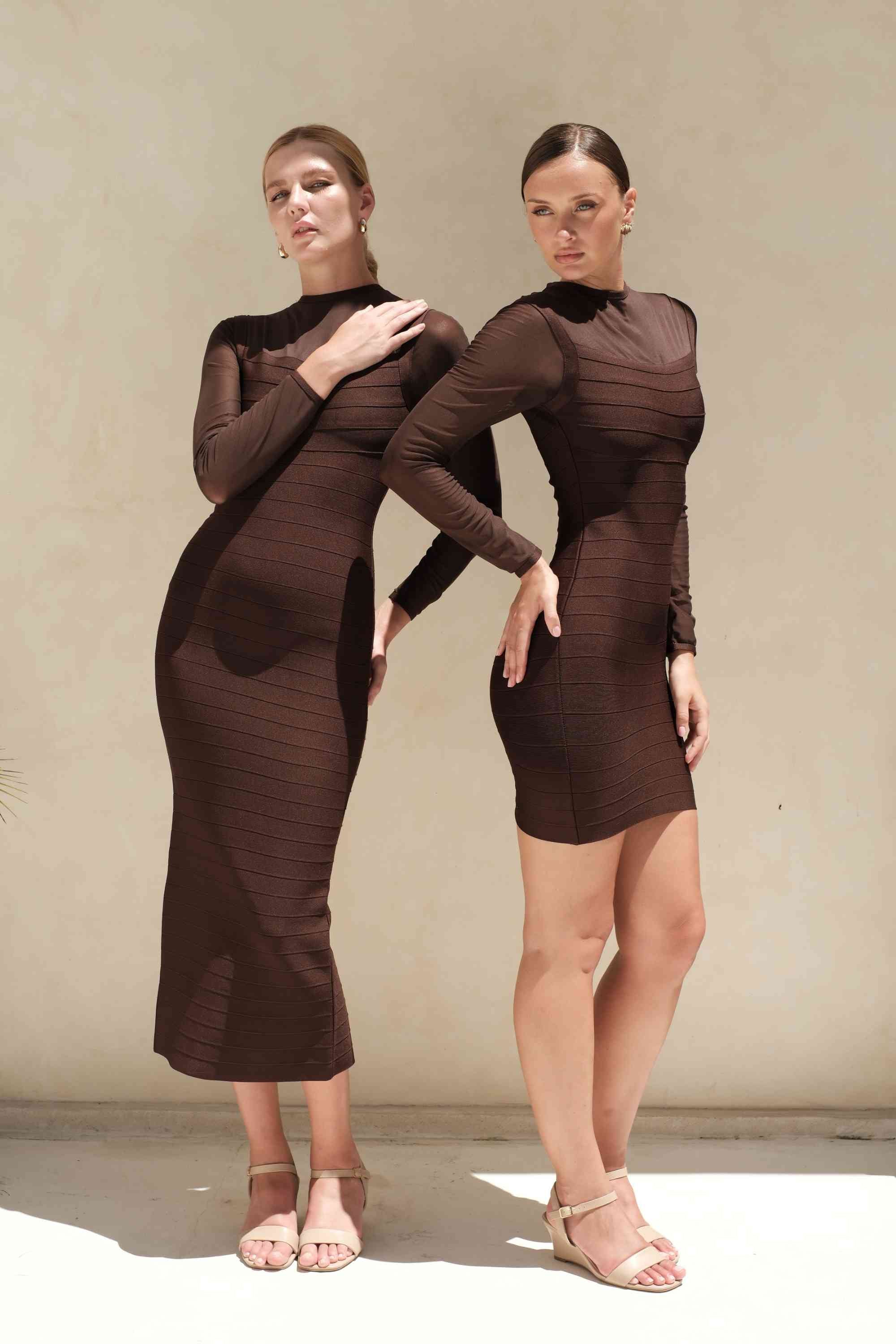 Woman wearing a figure flattering Robin Long Sleeve Bandage Mini Dress - White Pearl BODYCON COLLECTION Pty Ltd